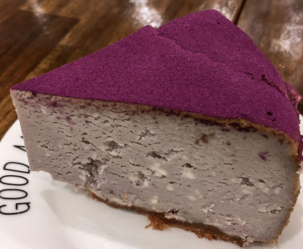 20 Unique Restaurants in Auckland New Zealand to Try in 2023 16 A slice of taro cheesecake with purple icing from one of the unique restaurants in Auckland New Zealand
