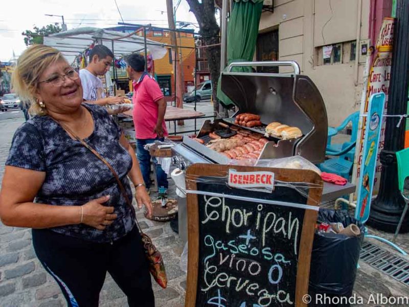 Traditional Argentinian Food You Need to Try 8 Choripan, a popular Argentinian Food, being BBQed at a street vendor in La Boca, Buenos Aires