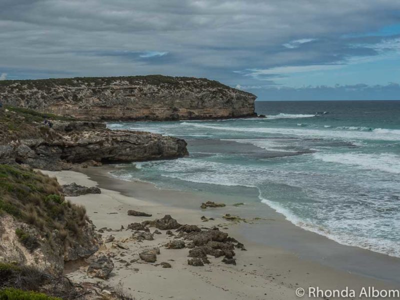 Things to Do in Kangaroo Island 19 Ocean waves coming into along a sandy beach and along the cliffs in Australia