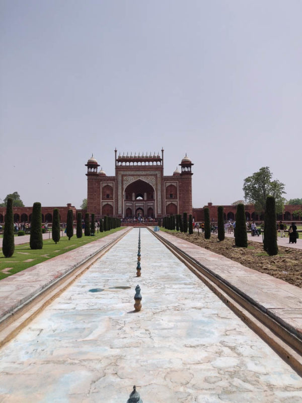 Visit Taj Mahal: a Comprehensive Travel Guide in India 3 Looking along the long path leading back to the main gate of the Taj Mahal in India