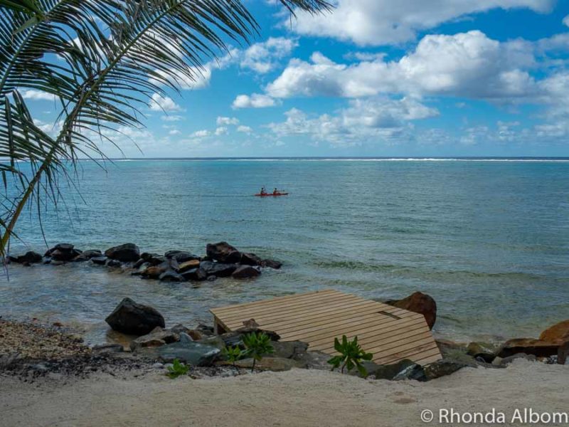 Rarotonga Travel Guide: What You Need to Know Before You Visit 5 Sand, small boardwalk, and a rocky shore at a resort on Rarotonga in the Cook Islands