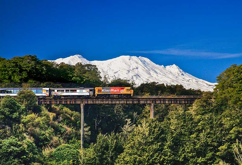 Kiwirail train in Waikato on the Manganui O Te Ao viaduct bridge