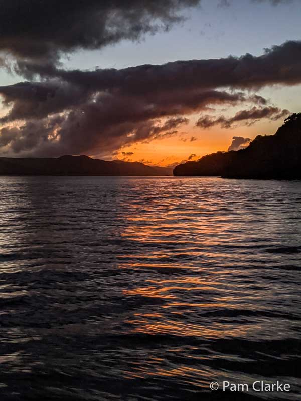 A 3-Day Stewart Island Itinerary: NZ’s Ecotourism, Kiwi, and Hiking 19 Sunset from a boat on Stewart Island