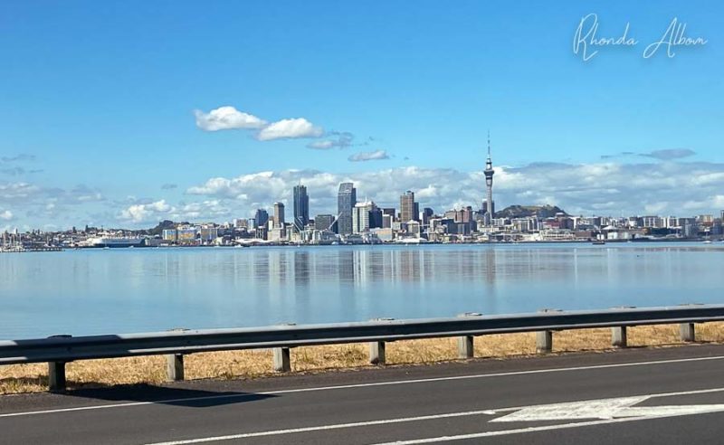 Auckland skyline on a calm day seen from the bridge entrance
