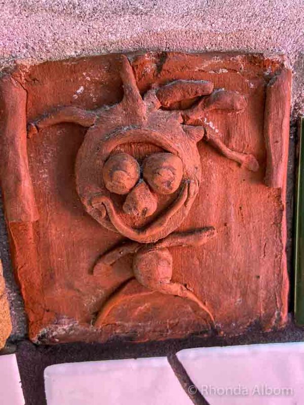 An integrated sculpture on the wall of the Kawakawa toilets