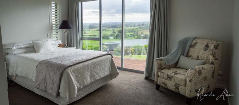 Romantic Getaway Auckland: An Inspired Paradise at Quail Lodge 12 Large queen bedroom with rural views at the guest unit of the Quail Lodge in Drury