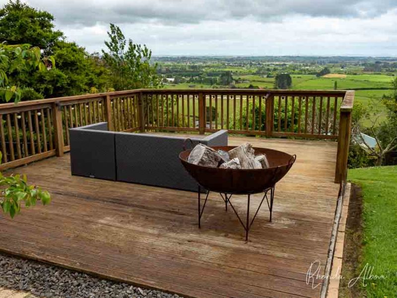 Romantic Getaway Auckland: An Inspired Paradise at Quail Lodge 18 fire pit on a deck overlooking rural views at a romantic getaway