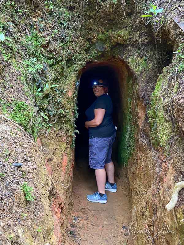 Woman entering the Gold mine at Driving Creek Railways in Coromandel Town