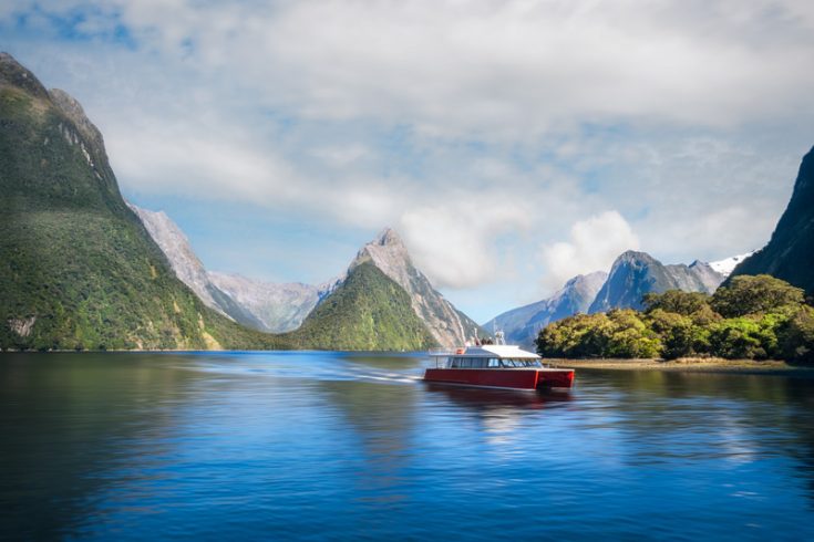 Boat at Milford Sound with Mitre Peak Behind