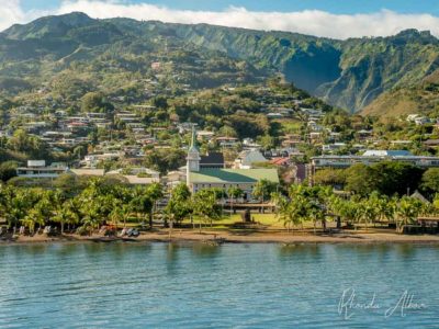 Charming coastal views and palm trees as we sail into Tahiti in French Polynesia