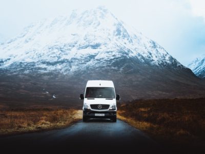campervan road trip with snowcapped mountain in the background