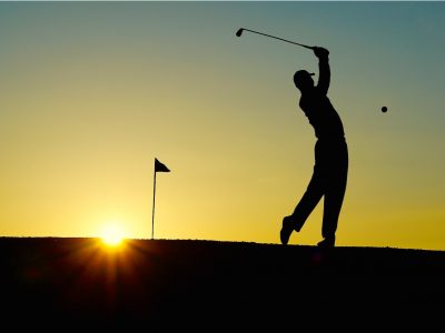 Silhouette of golfer on one of the best golf courses in New Zealand