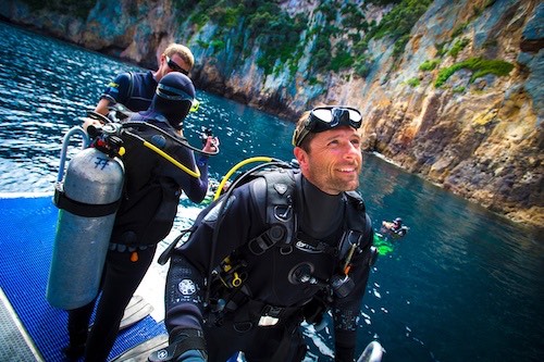 Scuba divers at Poor Knights Islands in New Zealand