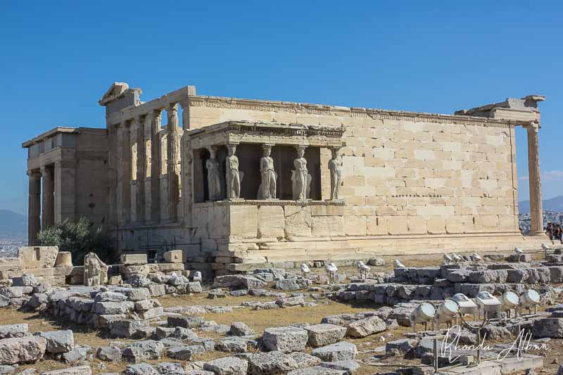 The Erechtheion (Erechtheum) is an ancient Greek temple dedicated to both Athena and Poseidon. On the Aropolis in Athens Greece