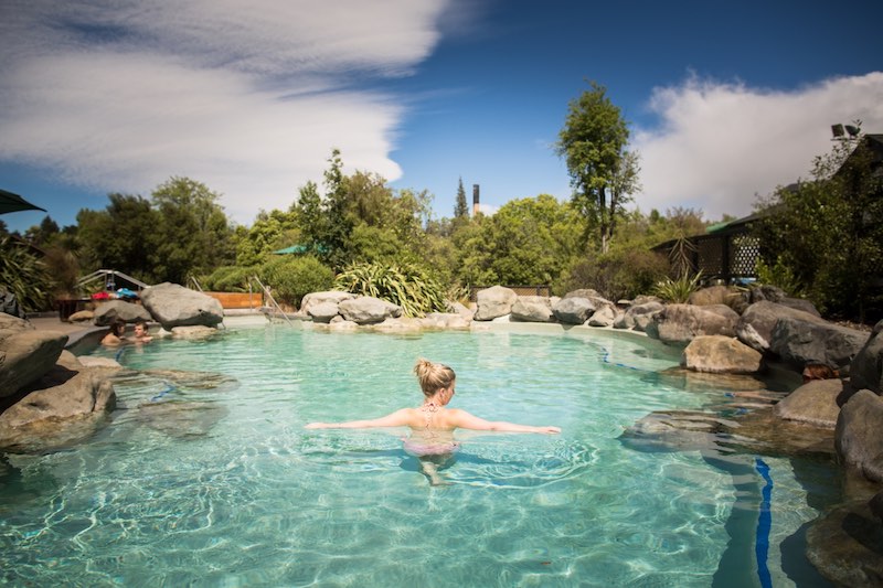 14 Best New Zealand Hot Springs - Relax, Soak, Unwind 15 Woman in thermal pool at Hanmer Springs