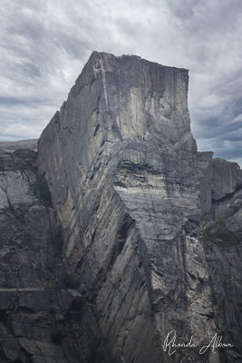 Discover 14 of Most Beautiful Fjords in the World 9 Prekestolen - the famous pulpit rock with its square horizontal plateau seen from seal level.
