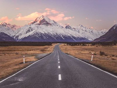 The road to Aoraki Mt. Cook National Park as part of a Christchurch to Queenstown road trip in New Zealand