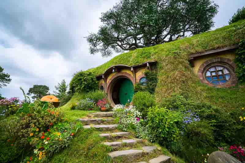 Hobbiton movie set created for filming The Lord of the Rings and The Hobbit movies in North Island of New Zealand is a must see stop if driving from Auckland to Tauranga
