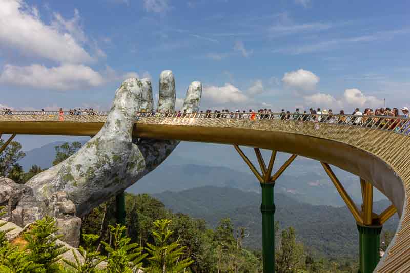 14 Fascinating Things to Do in Da Nang Vietnam 12 Tourists in Golden Bridge known as “Hands of God”, a pedestrian footpath lifted by two giant hands in Vietnam