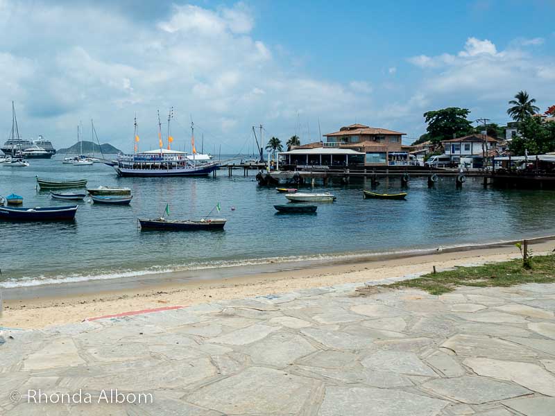 Praia de Armacao a beach and cove filled with fishing boats.