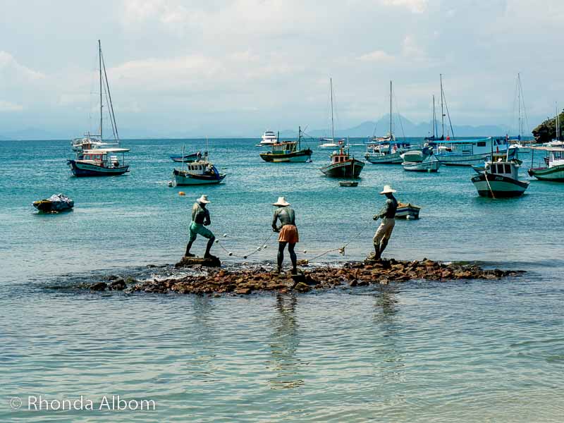 Statue of the Three Fisherman at Praia da Armacao in Buzios Brazil