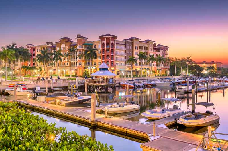 Naples, Florida, USA town skyline on the water at dawn. One of the day trips from Miami