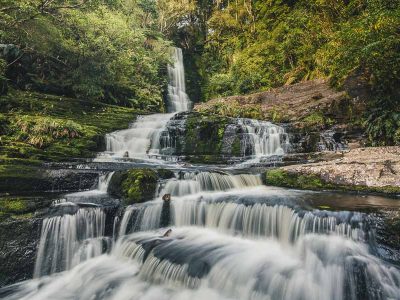 Hiking to Mclean Falls in the Catlins is one of the amazing things to do in the South Island of New Zealand