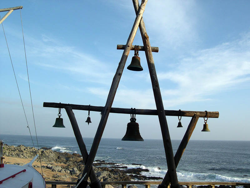 art work with bells outside House of Pablo Neruda in Isla Negra seen on one of our Santiago day trips