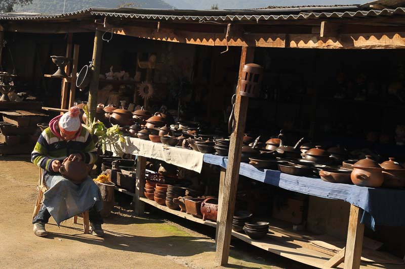 man working on pottery in Pomaire, Chile