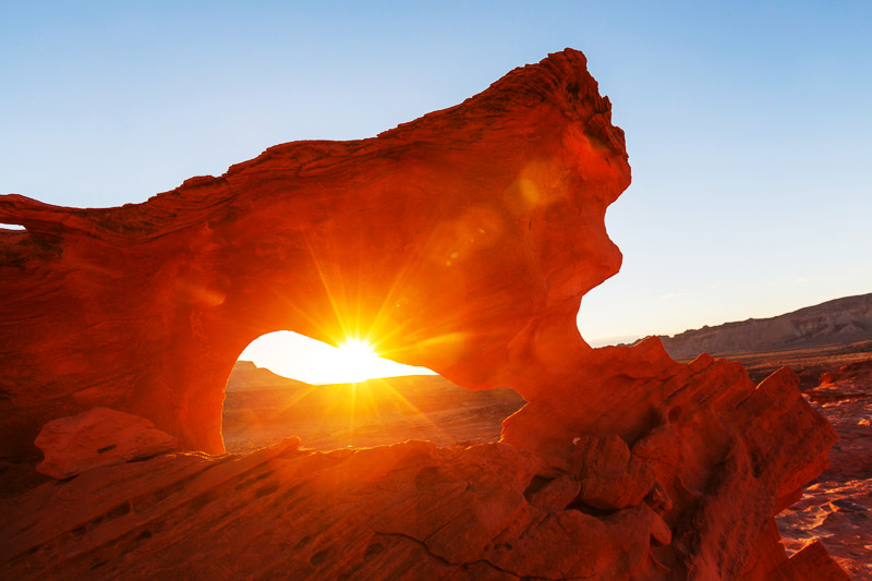 Sunset in the Valley of Fire State Park creating a red cast over the rocks