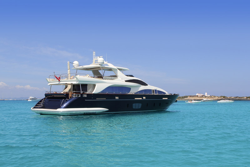 A great boating experience on a luxury yacht in turquoise near Illetes Formentera in the Mediterranean sea by the Balearic Islands