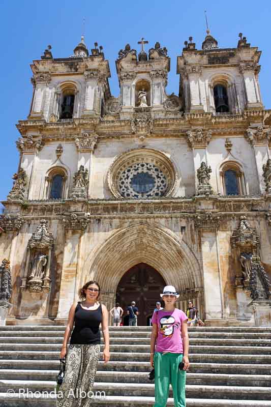 11 Day Trips from Lisbon: Unforgettable Escapes in Portugal 14 Two girls standing in front of the monastery in Alcobaca Portugal