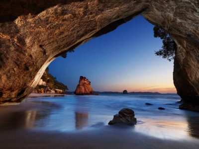 Cathedral Cove is one of the must see things to do in North Island New Zealand. This sunrise shot brings out more colours.