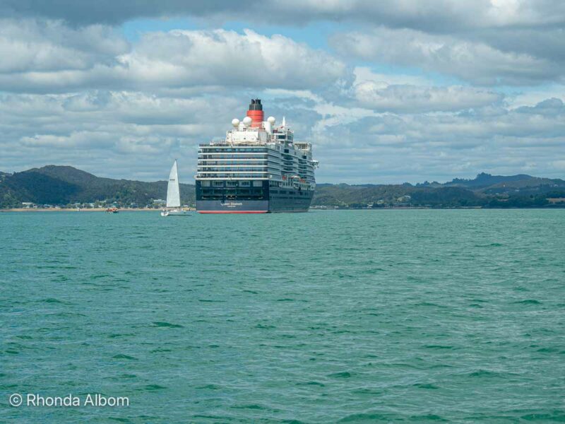 Queen Elizabeth cruise ship at a mooring as there is no actual Bay of Islands Cruise Port in New Zealand