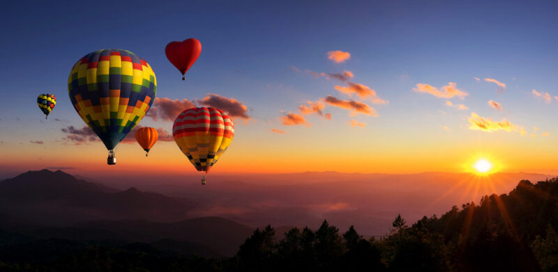Colourful hot air balloons flying at d sunset at Doi inthanon, Chiang mai, Thailand.
