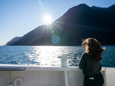 Traveller with beautiful scenic of milford sound in fiordland national park ond of the New Zealand cruise ports.