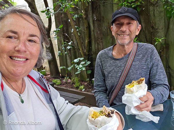 Eating glulten-free burritos at Roll Up in Raglan