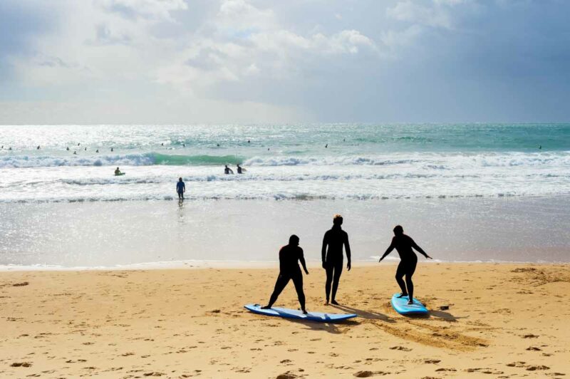 Surfers on the beach in Portugal.