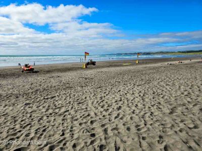Swim between the flags in Raglan, a reminder that ignore water safety is one of things not to do in New Zealad.