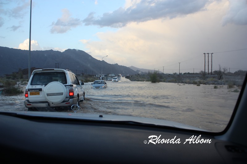 Water too deep for cars without 4 wheel drive to pass as the streets in Oman flood Desert flash flooding road danger and cars can no longer pass without 4 wheel drive