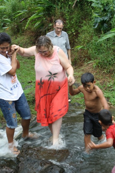 Being helped across the stream