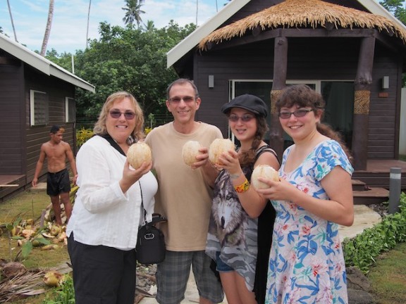 Enjoying the fresh coconut milk