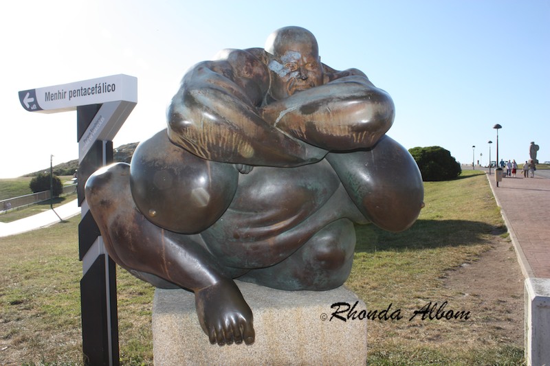 Funny Statue with huge body parts near the Tower of Hercules, La Coruna, Spain Funny Statue with huge body parts near the Tower of Hercules, La Coruna, Spain