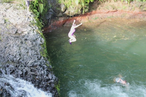 Jumping into the Togitogiga Waterfall, Samoa